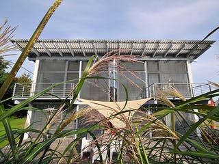 Fertighaus Sabine (KfW-Effizienzhaus 40 EE) von Dammann-Haus Schlüsselfertig ab 444200€, Pultdachhaus Außenansicht 2