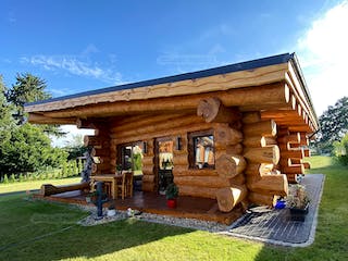 Blockhaus Blockhaus Ostsee von Holzbau Rustikal - Blockhäuser Bausatzhaus ab 73756€, Pultdachhaus Außenansicht 2