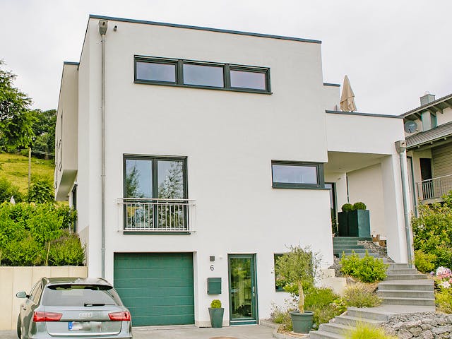 Massivhaus Elegantes Flachdachhaus am Hang von RheinMassiv Massivhäuser, Cubushaus Außenansicht 1