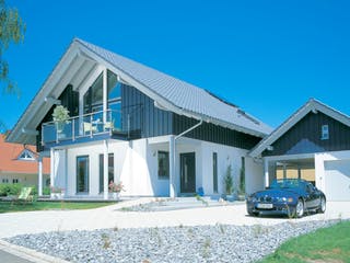 Fertighaus E 15-205.1 - Haus mit Wintergarten von SchwörerHaus - Österreich Schlüsselfertig ab 556490€, Außenansicht 2