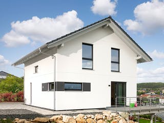 Fertighaus E 15-121.7 - Kundenhaus mit Eigenleistungen von SchwörerHaus - Österreich, Außenansicht 2