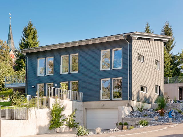 Fertighaus E 20-196.2 - Energiesparhaus von SchwörerHaus - Österreich Schlüsselfertig ab 586190€, Pultdachhaus Außenansicht 1